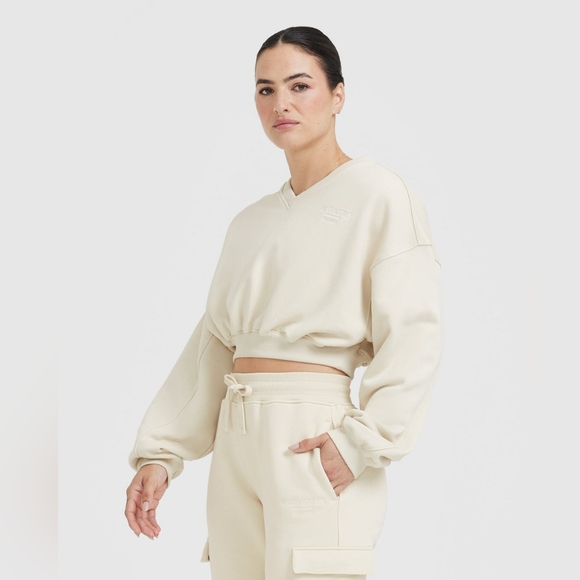 Oner Active Tops - NEW Oner Active ALL DAY EST 2020 CROP V-NECK SWEATSHIRT in Vanilla Cream